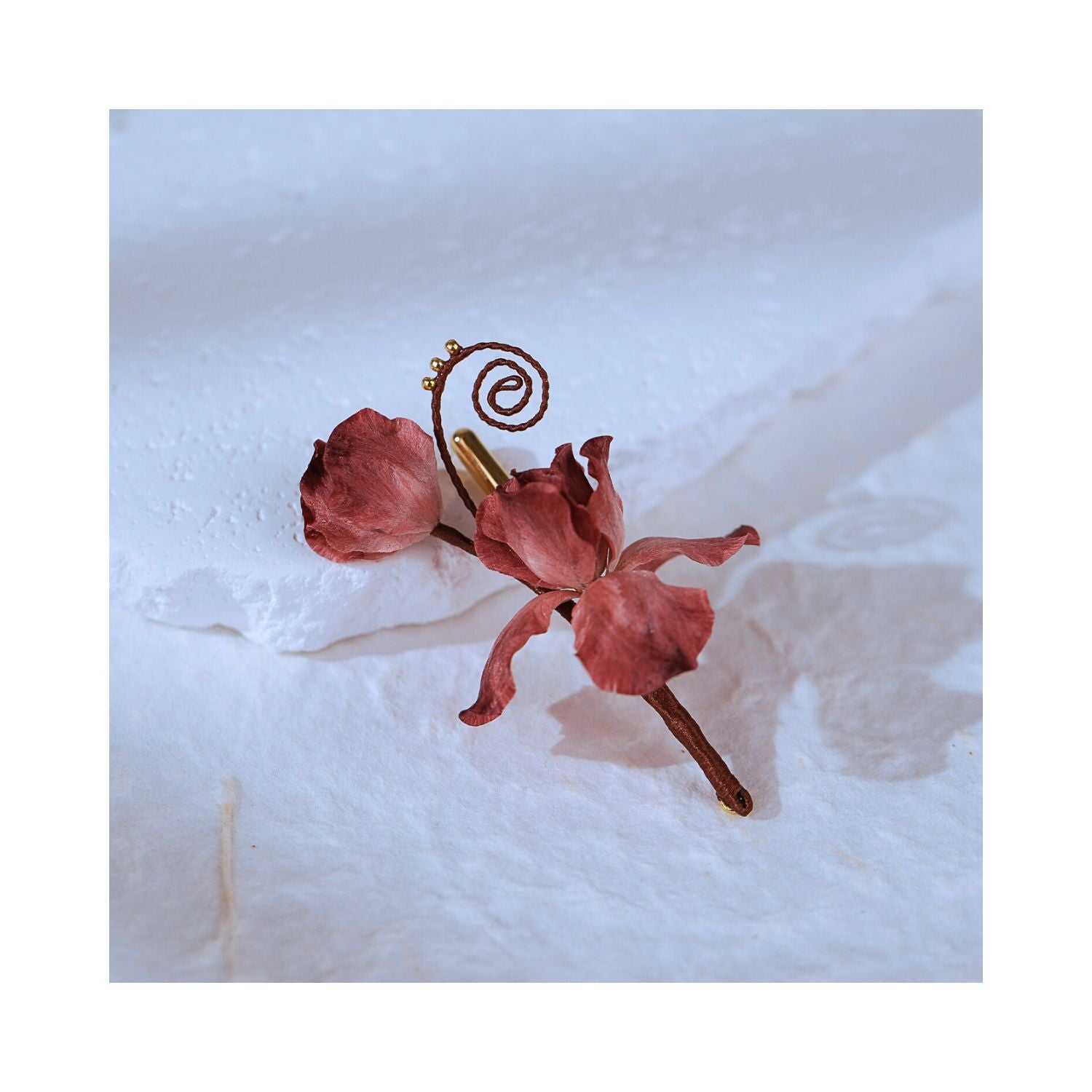 Detail view of Cloud Iris handmade iris floral brooch on a light background, emphasizing silk texture, sculptural bloom, and small-batch artisan finish.