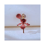 Front view of Cloud Iris mulberry silk Ronghua iris brooch on a light background, highlighting curled tendrils, layered petals, and handcrafted floral form.
