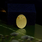 Back detail of a custom mother-of-pearl inlay brooch showing the gold-tone pin setting.