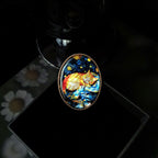 Custom mother-of-pearl inlay cat brooch with colourful shell artwork and polished brooch setting.