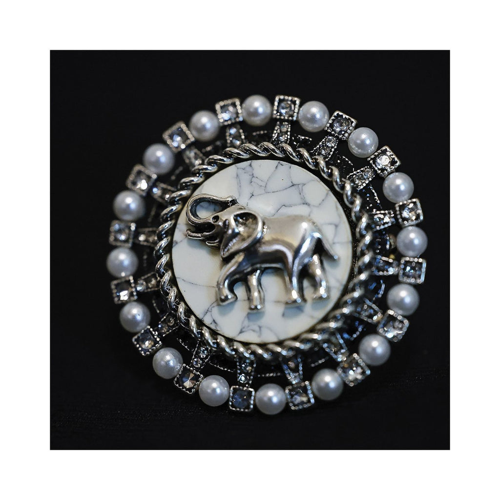 Jinherit Gentle Guardian vintage elephant brooch pin with faux pearl accents, round badge silhouette, aged silver-tone detail, and quiet strength symbolism.