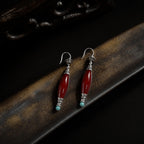 Jinherit Ancient Ember red agate and turquoise drop earrings shown in close product detail, featuring polished natural stones, antiqued silver-tone components, and hook earring construction.