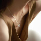 Jinherit Celestial Haze fine silver gourd necklace worn by a model, showing the petite cloisonné enamel pendant, delicate 925 sterling silver chain, and quiet everyday elegance.