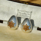 Jinherit Eternal Star mixed-metal stud earrings detail, showing the brushed silver-tone teardrop frame, raised vintage-gold star motif, and refined artisanal metal texture.