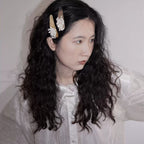 Jinherit Frosted Bloom ivory beaded velvet Snap Clip worn by a model, showing its floral beadwork, soft vintage mood, and polished side-hair styling.