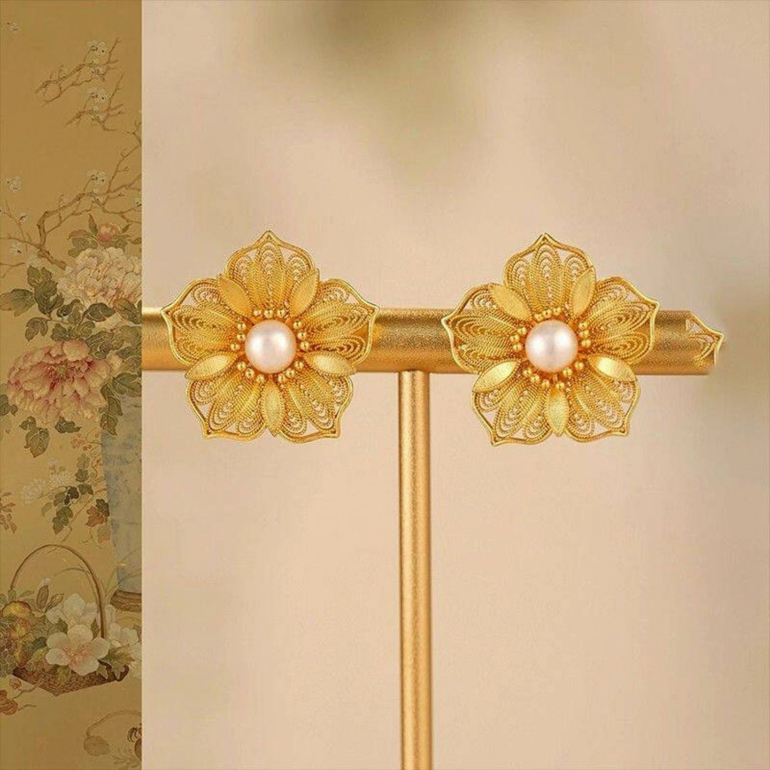 Jinherit Golden Bloom filigree pearl flower stud earrings front detail, showing layered gold-plated petals, lace-like metalwork, and luminous freshwater pearl centers.