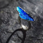 Jinherit Into the Blue handcrafted enamel ring side detail, highlighting the raised blue enamel form, distressed sterling silver texture, and sculptural adjustable open band.