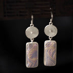 Jinherit Lilac Loom Song Brocade dangle earrings, featuring lilac and gold woven silk texture, silver-tone circular details, and a graceful rectangular drop silhouette.