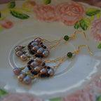 Jinherit Lustrous Tide pearl tassel drop earrings shown in product detail, highlighting cascading pearl drops, green stone accents, black spinel beads, and chandelier earring construction.