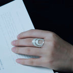 Jinherit Moon Phases filigree open ring worn on hand, featuring 999 fine silver, moon-inspired curves, and a sculptural adjustable open-ring silhouette.