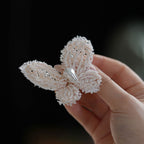 Jinherit Pearl Flutter pearl beaded butterfly duckbill hair clip detail, showing the layered beadwork, natural pearl accent, and dimensional handmade wing construction.