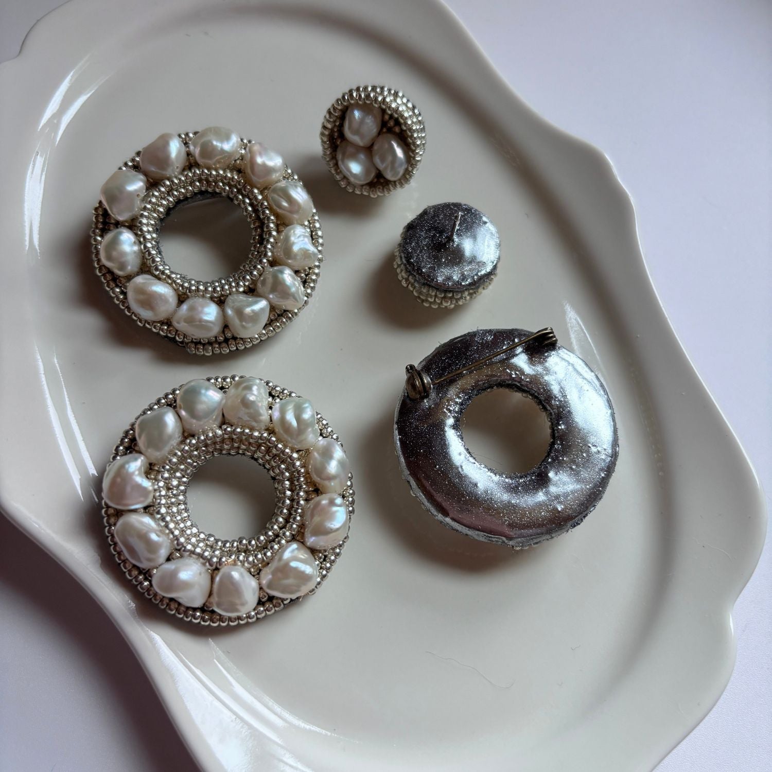 Jinherit Silver Halo baroque pearl embroidered brooch pin front and back detail, showing the pearl-beaded face and reinforced artisan backing construction.