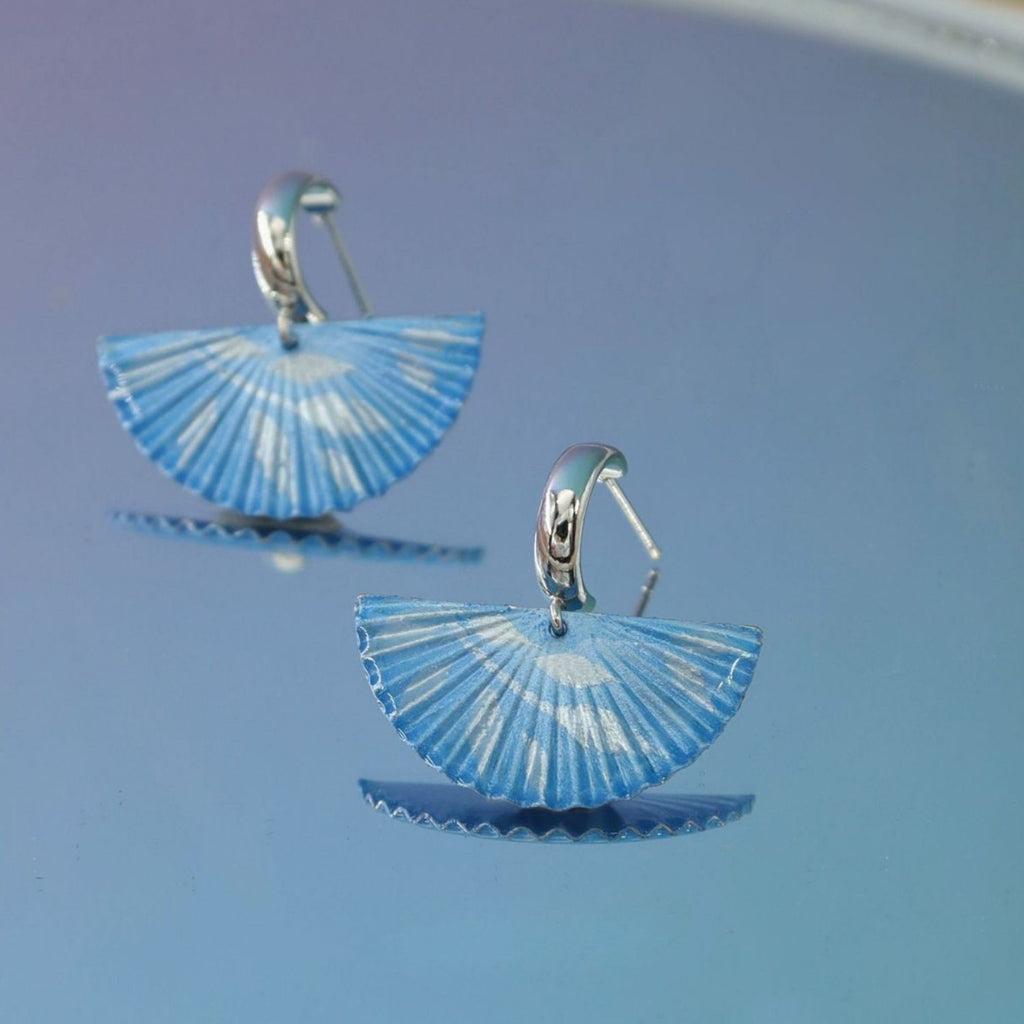 Jinherit The Four Seasons hand-painted fan dangles in Winter Whisper, featuring soft blue fan-shaped earrings with airy painted lines and a calm winter-inspired elegance.