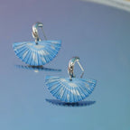 Jinherit The Four Seasons hand-painted fan dangles in Winter Whisper, featuring soft blue fan-shaped earrings with airy painted lines and a calm winter-inspired elegance.