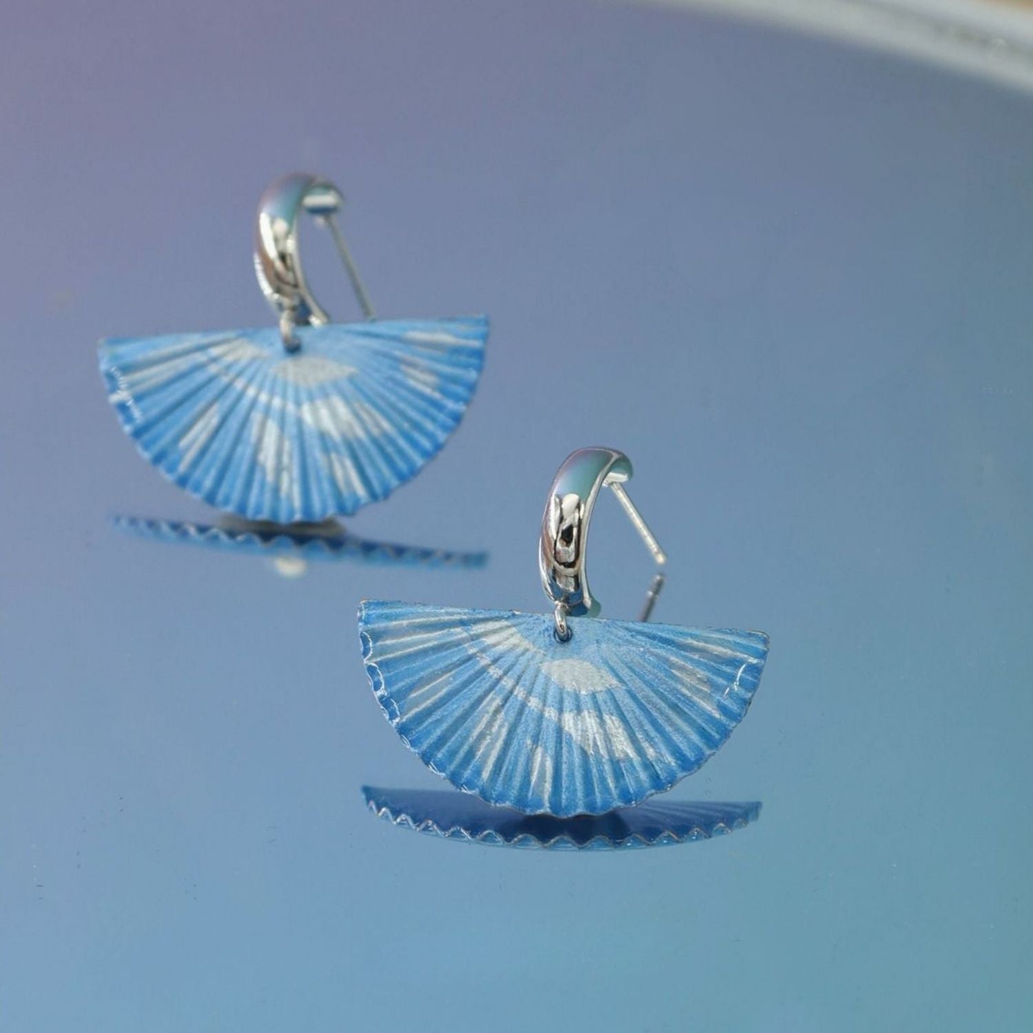 Jinherit The Four Seasons hand-painted fan dangles in Winter Whisper, featuring soft blue fan-shaped earrings with airy painted lines and a calm winter-inspired elegance.