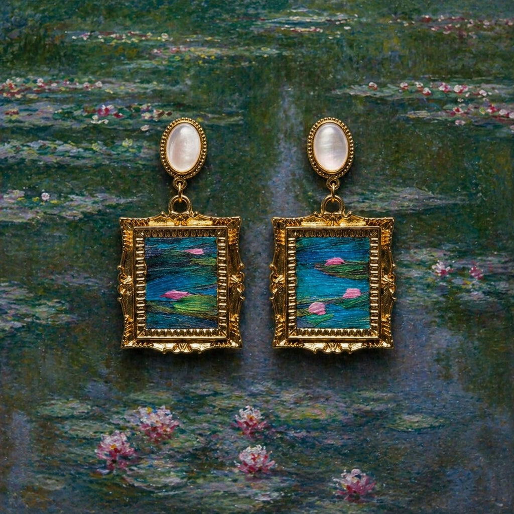 Jinherit Water Lily Dream feather inlay drop earrings on a water lily painting-inspired background, featuring iridescent feather inlay, mother-of-pearl tops, and gold-plated framed details.