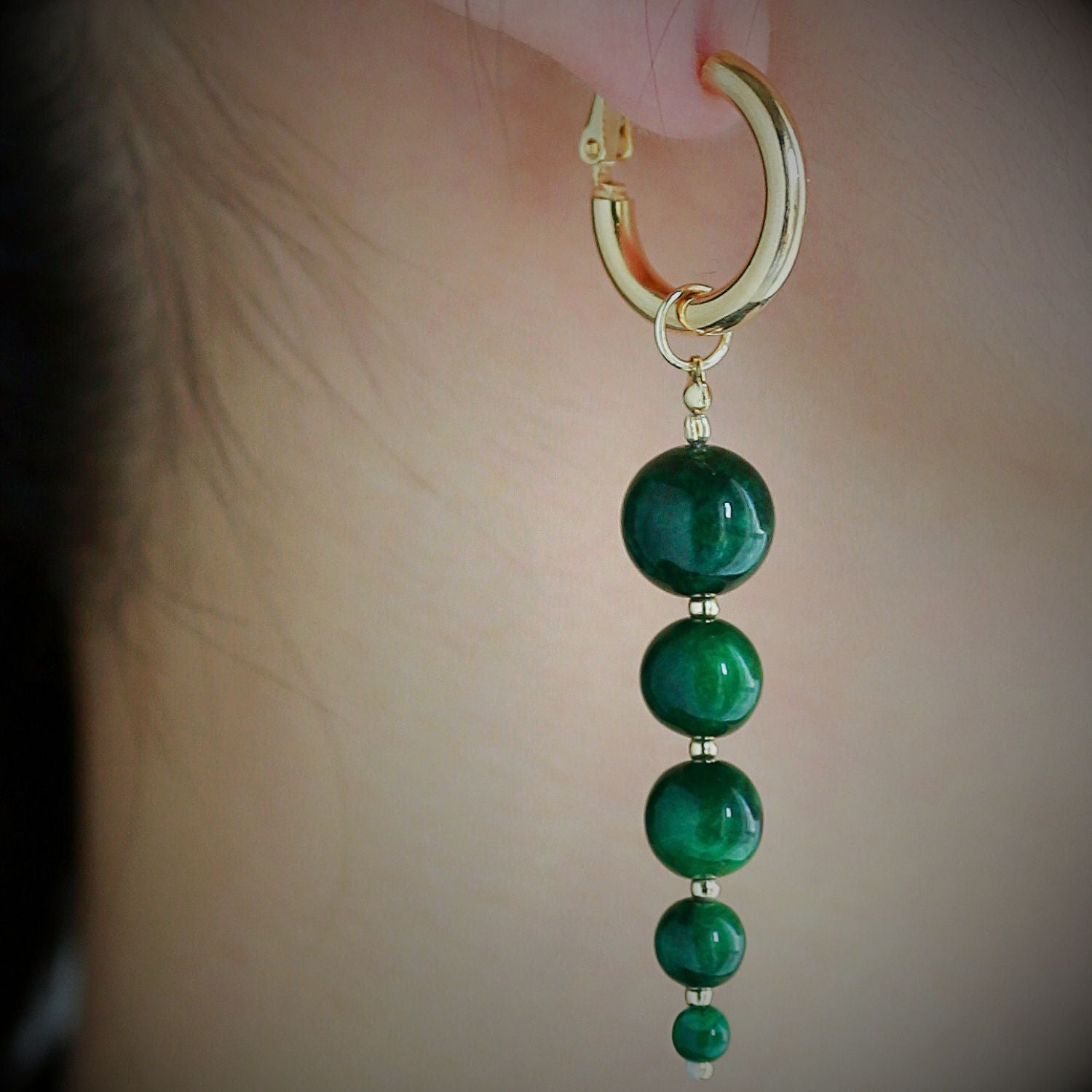 Jinherit Zen Line emerald-green bead drop hoops close-up, highlighting the smooth green bead lustre, graduated vertical arrangement, and gold-tone hoop connection.