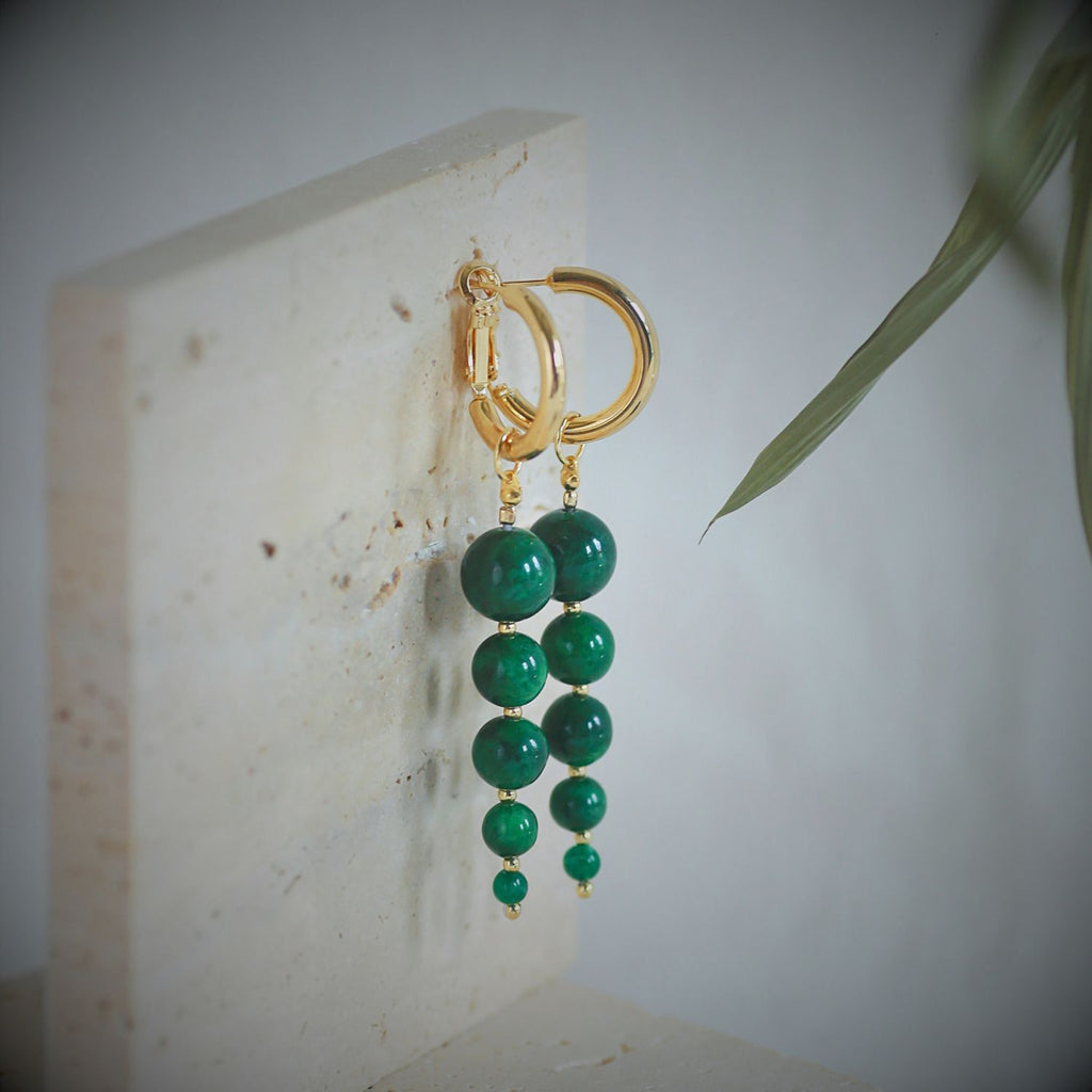 Jinherit Zen Line emerald-green bead drop hoops product detail, featuring five graduated green beads, a polished gold-tone hoop, and a balanced sculptural drop design.