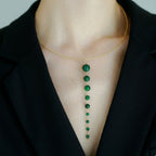 Jinherit Zen Line emerald-green Y-drop lariat necklace worn by a model, featuring a gold-tone collar necklace with a vertical cascade of graduated green beads and a refined minimalist silhouette.