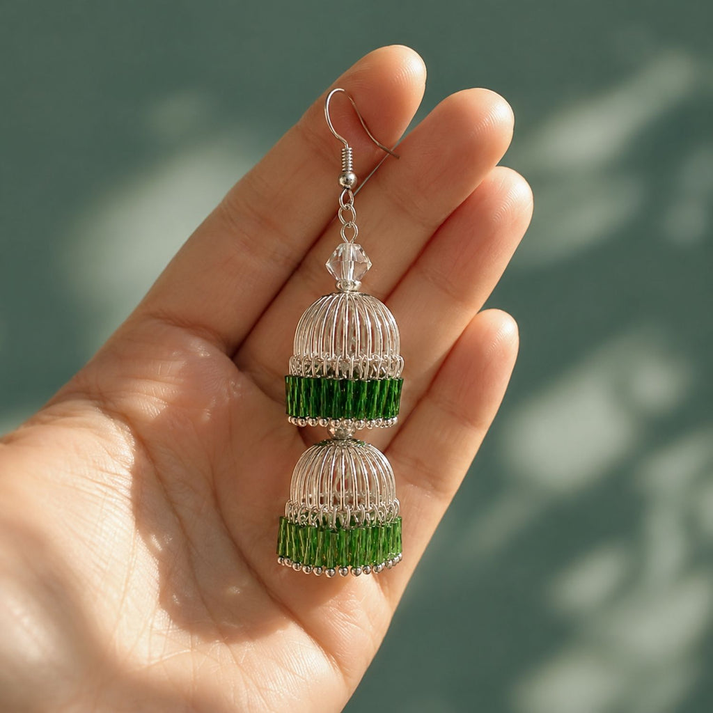 Model wearing Emerald Lantern gradient beaded lantern drop earrings, showing lightweight movement, hand-strung bead detail, and face-framing silhouette.