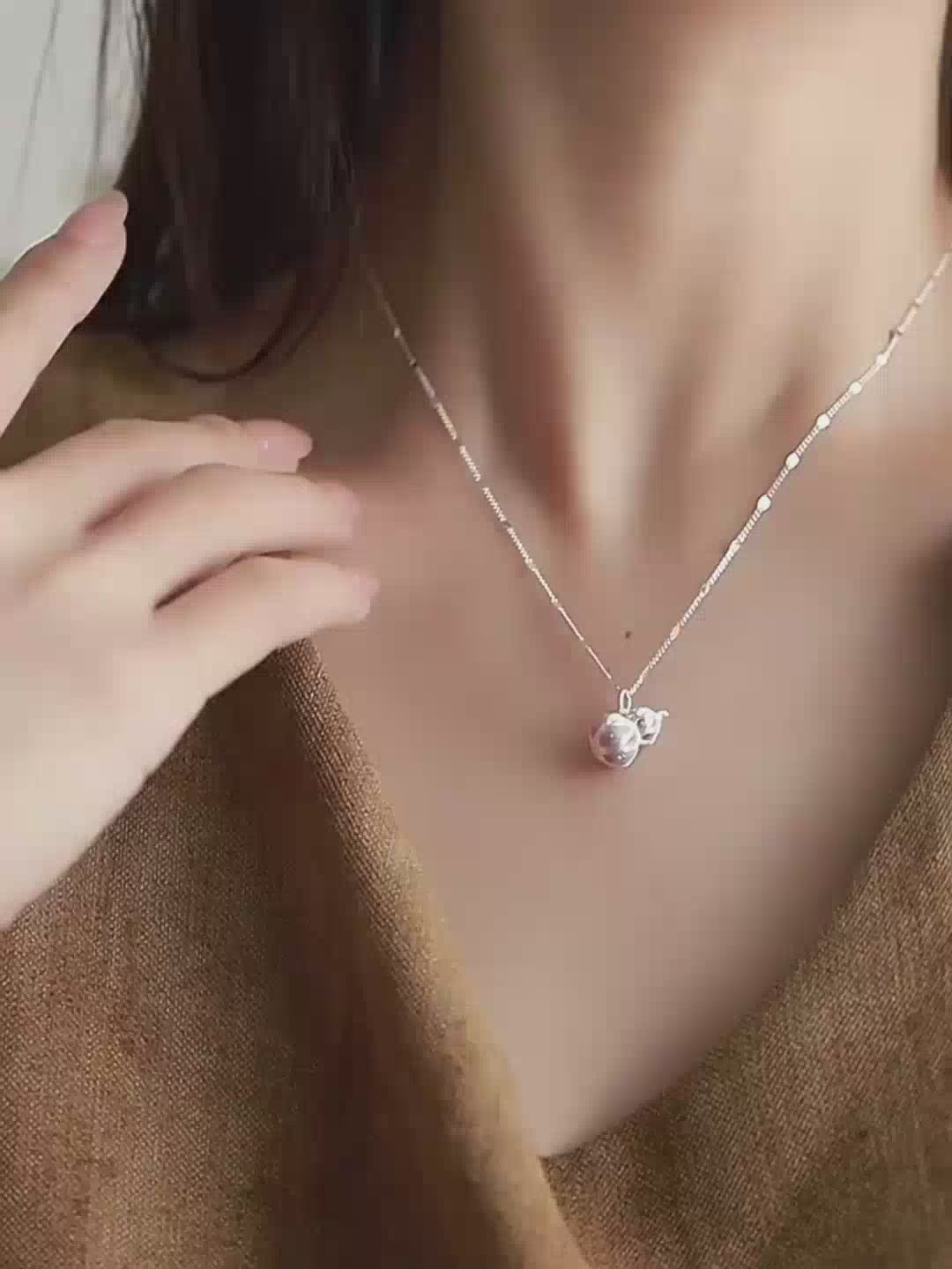 Jinherit Celestial Haze silver gourd pendant necklace shown in a model wearing detail video, highlighting the 999 fine silver hulu pendant, cloud-tinted enamel, 925 silver chain, and meaningful blessing symbolism.