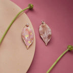 Jinherit Spring Reverie asymmetric hand-painted petal earrings video, highlighting the model wearing effect, face-framing silhouette, freshwater pearl studs, and romantic floral movement.