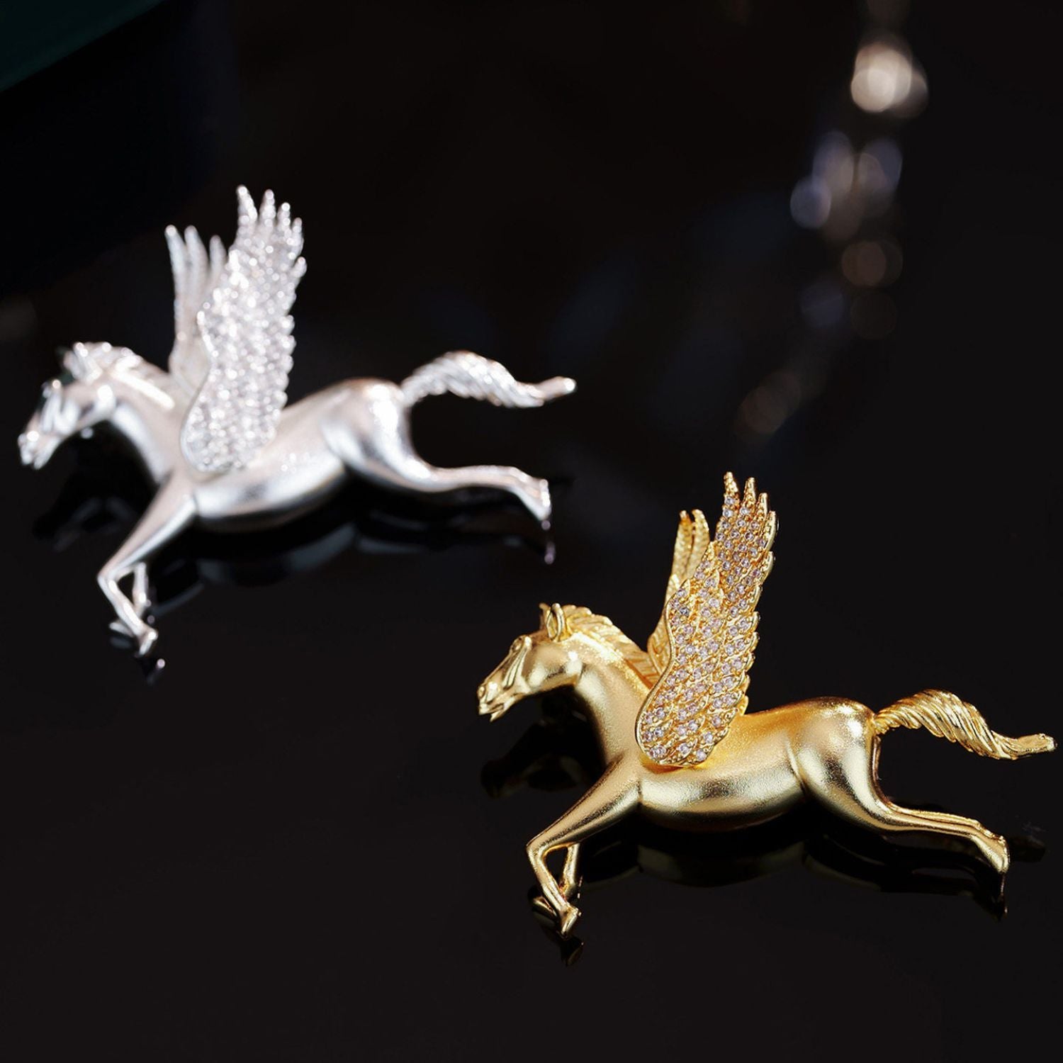 Jinherit Wings of Inspiration Pegasus brooch pin detail video showing sculpted winged horse form, pavé CZ wings, gold and silver tone finishes, and myth-inspired movement.