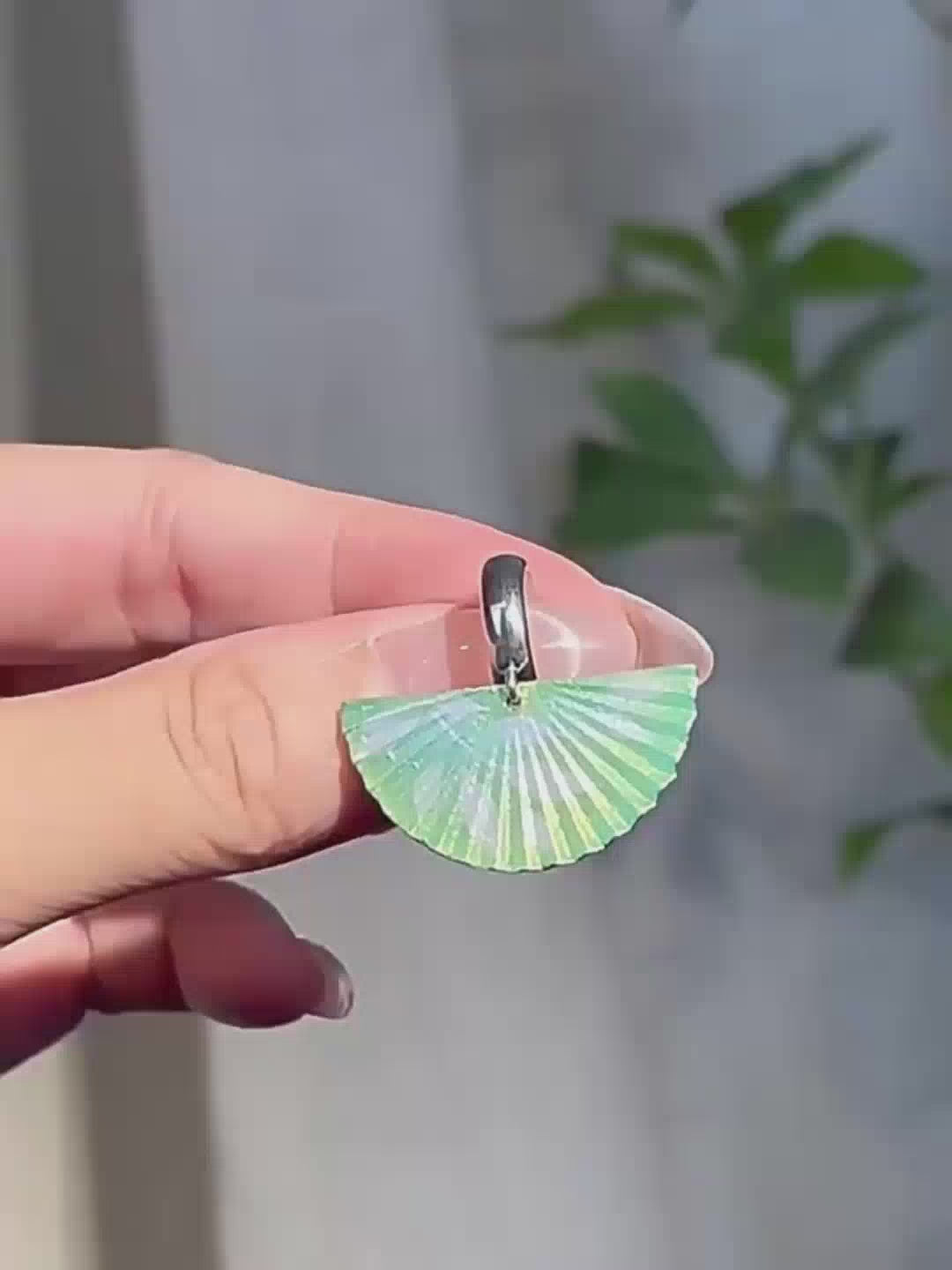 Jinherit The Four Seasons hand-painted fan dangle earrings shown in a wearing detail video, highlighting the sculptural fan silhouette, seasonal painted colors, and light artistic movement.