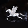 Silver-tone Pegasus brooch with feather-textured wings, CZ sparkle, and polished finish.